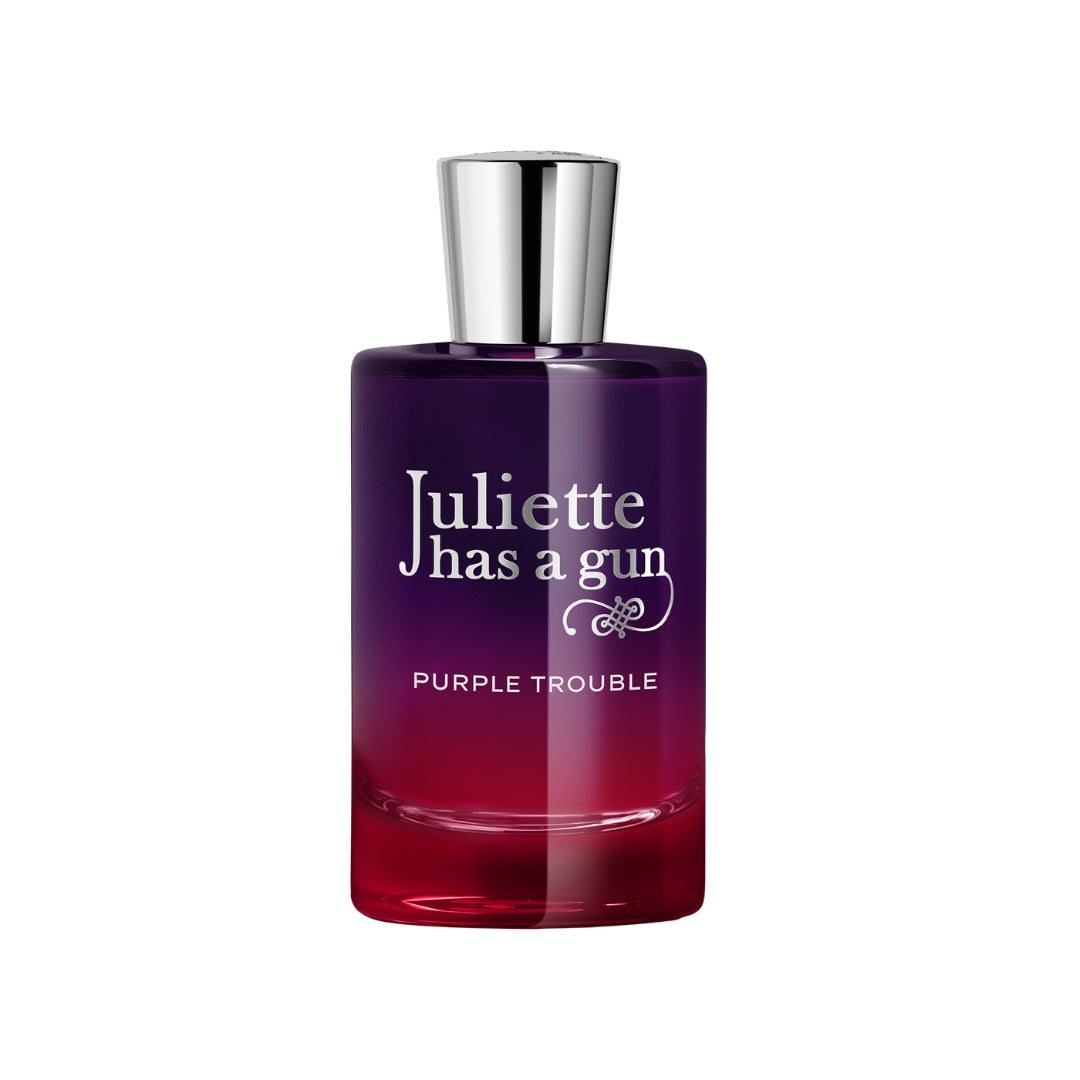 Juliette has a gun Purple Trouble perfume bottle with a silver cap, featuring a purple-to-red gradient glass design on a white background.