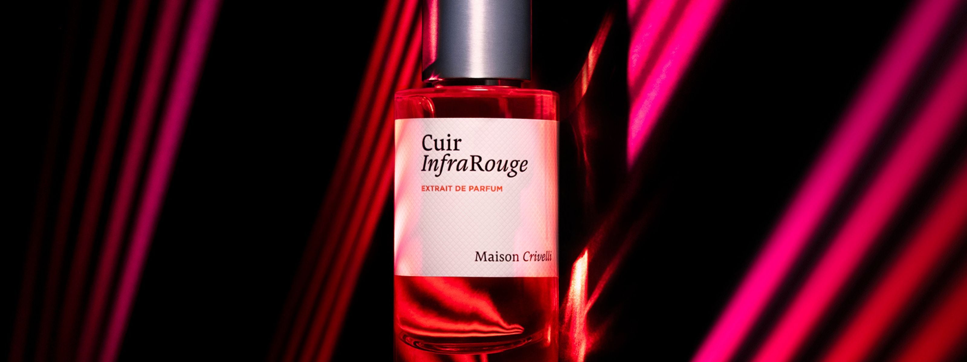 Perfume bottle labeled 'Cuir InfraRouge' with a pink label against a dark background