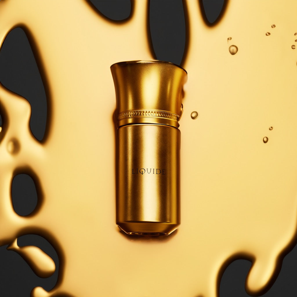 Gold cylindrical object with 'LOUIS' branding on a black and gold abstract background
