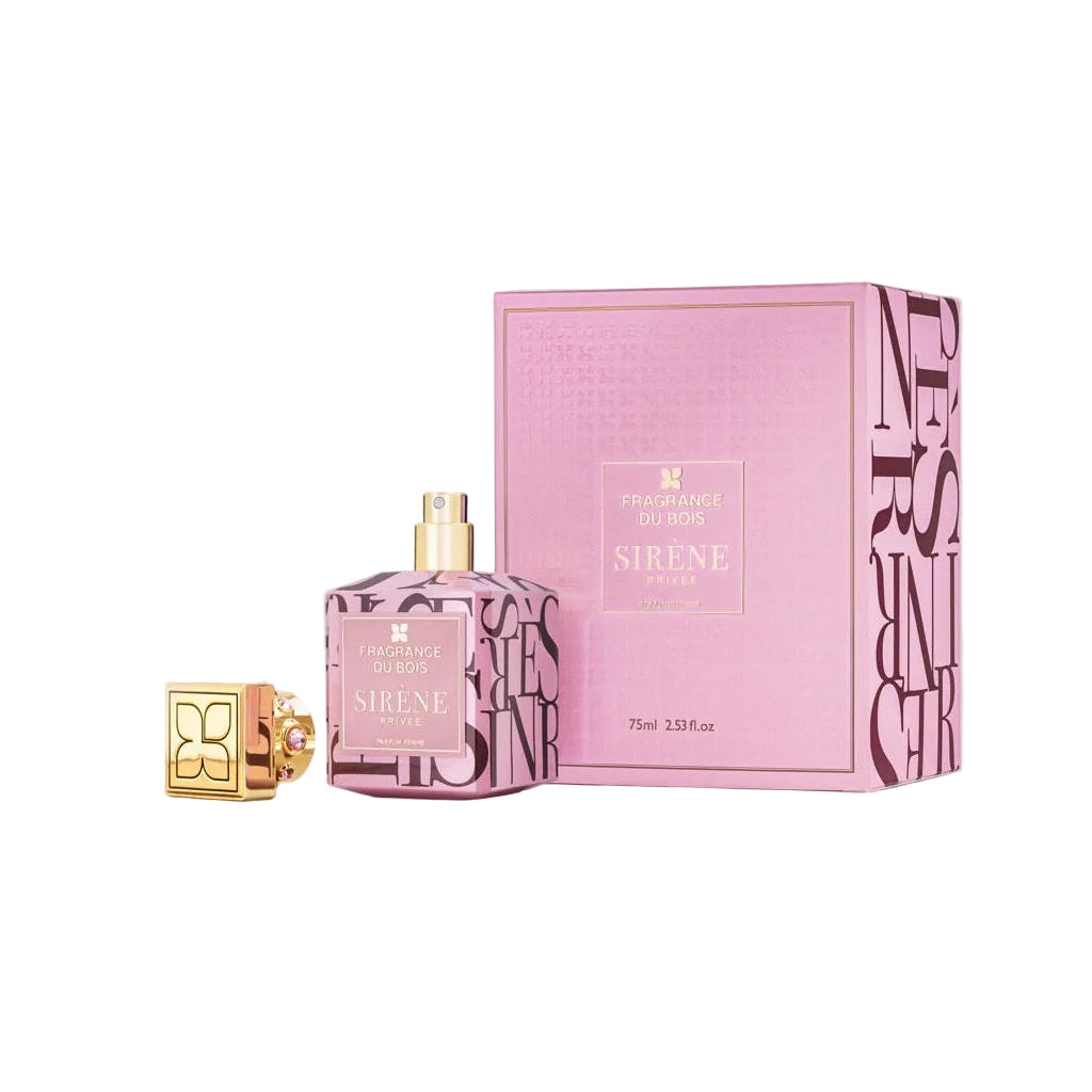 Pink perfume bottle and packaging on a light gray background